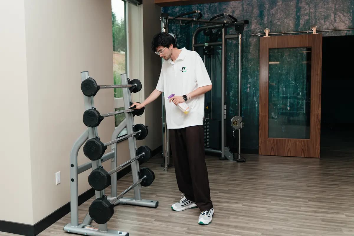 Sanitizing dumbbells and weight racks in a fitness center