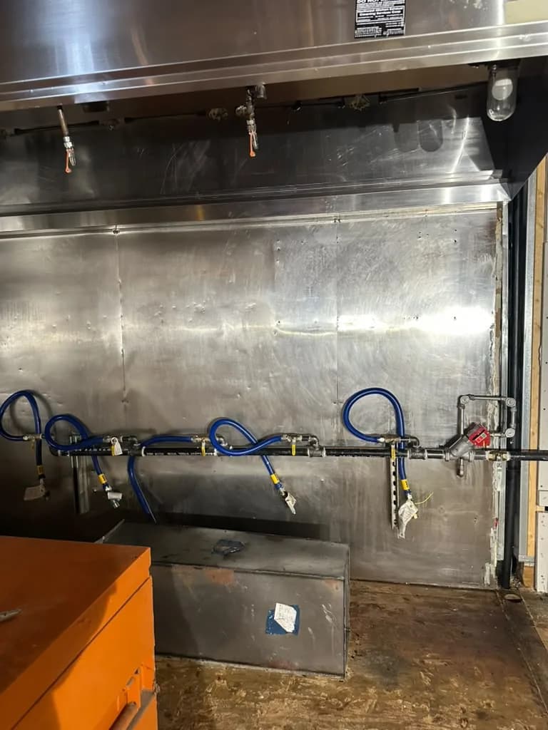 Stainless exhaust hood and gas line wall degreased in a Lynnwood commercial kitchen
