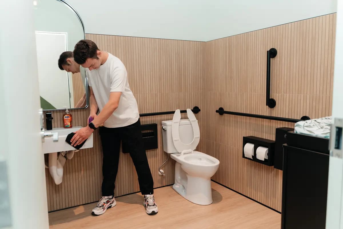 Common-area restroom sink and fixtures cleaned to spec