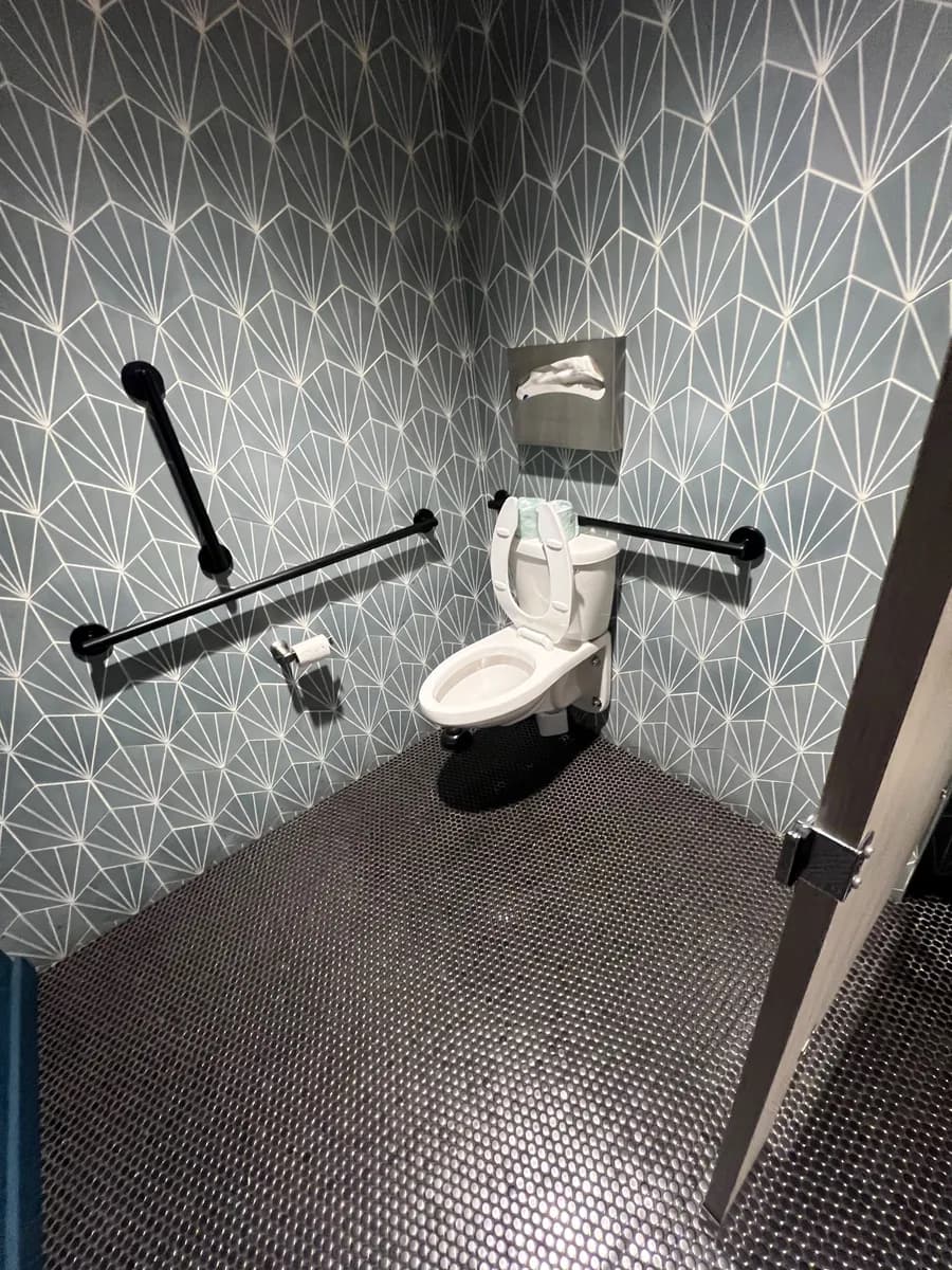 Accessible restroom with patterned tile in a Bellevue restaurant space