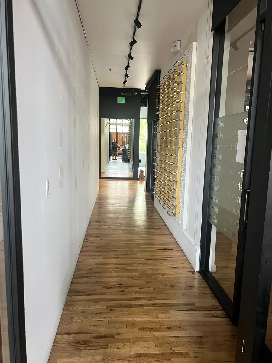 Hardwood corridor leading to the front of a Bellevue restaurant space