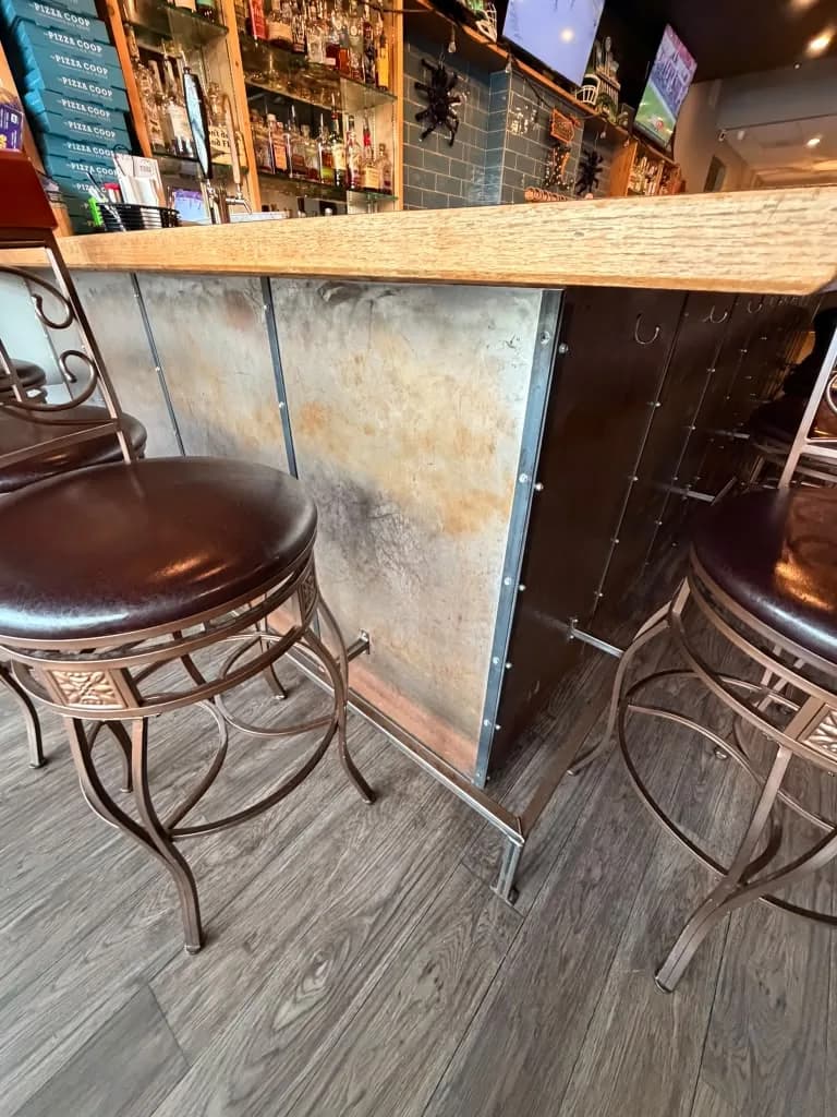 Bar front and swivel stools at The Pizza Coop & Ale House in Woodinville