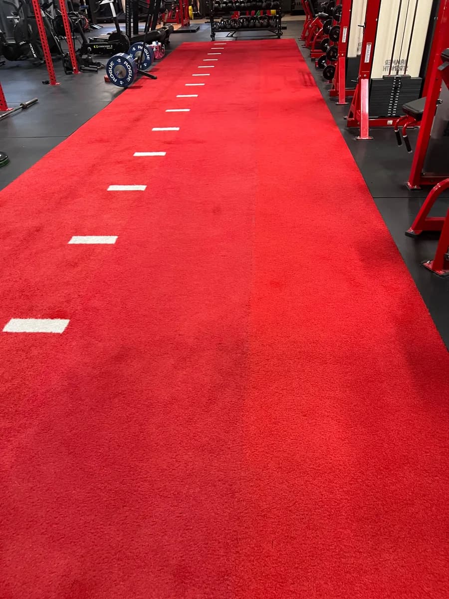 Red artificial turf training lane at Transform 180 in South Lake Union, Seattle