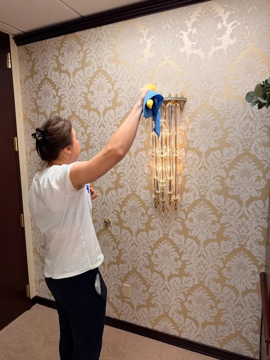 Detail cleaning of a wall fixture at NAEGELI Deposition & Trial, a downtown Seattle law office
