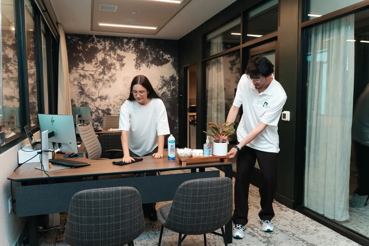 Premium Services WA crew disinfecting workstations in a shared office